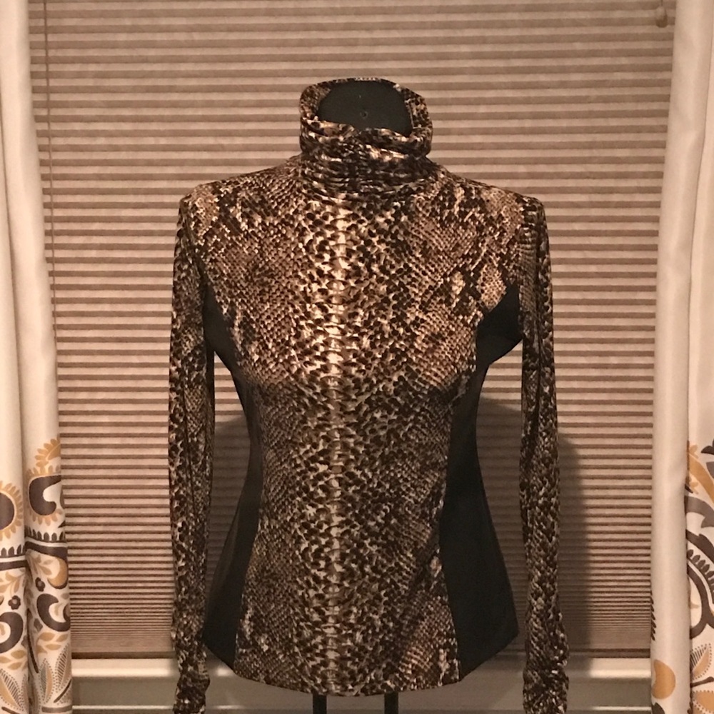 Snake print turtleneck with faux leather on side.